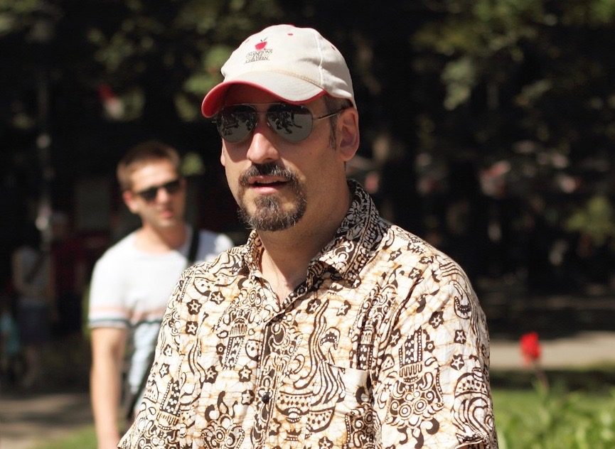 Mark Modzelewski Executive Artistic Director with goatee, sunglasses and baseball cap